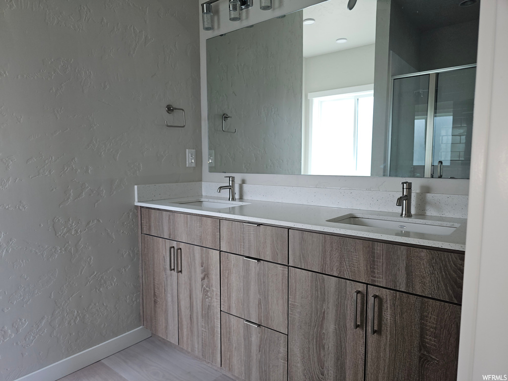 Bathroom with mirror and double vanity