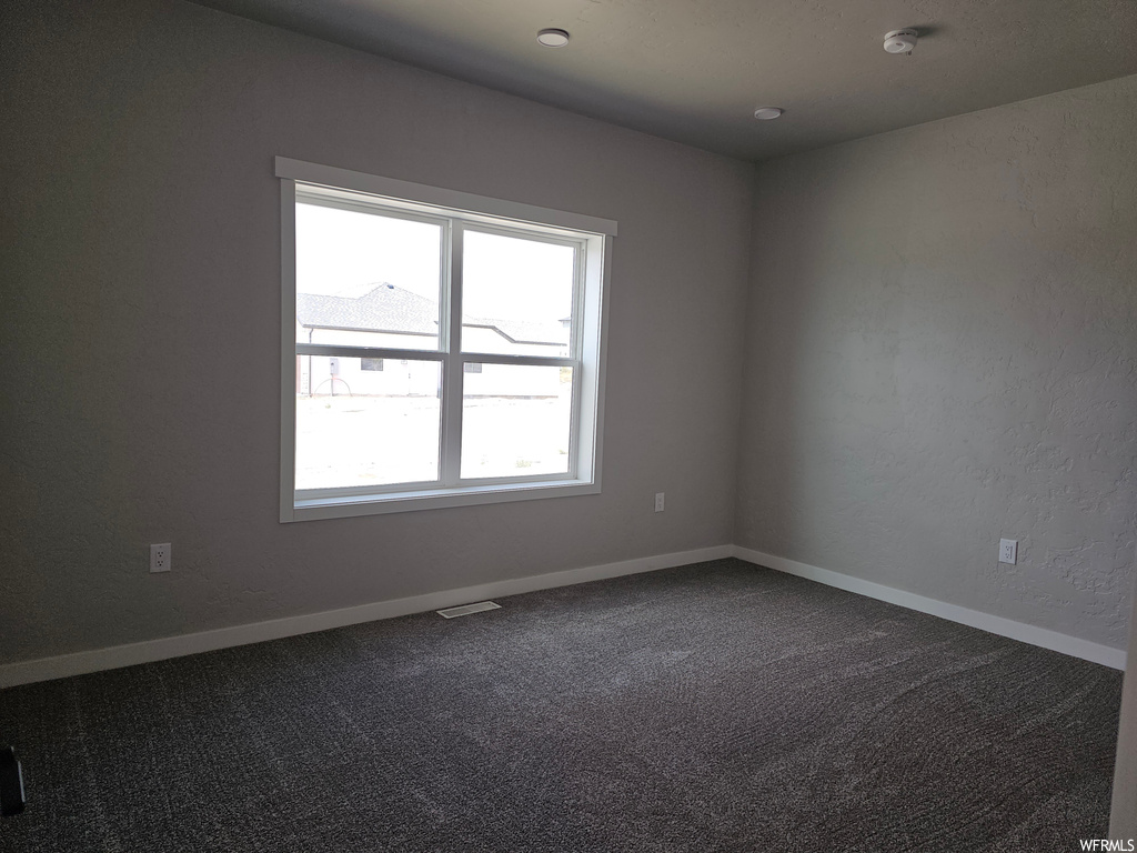 Empty room featuring carpet