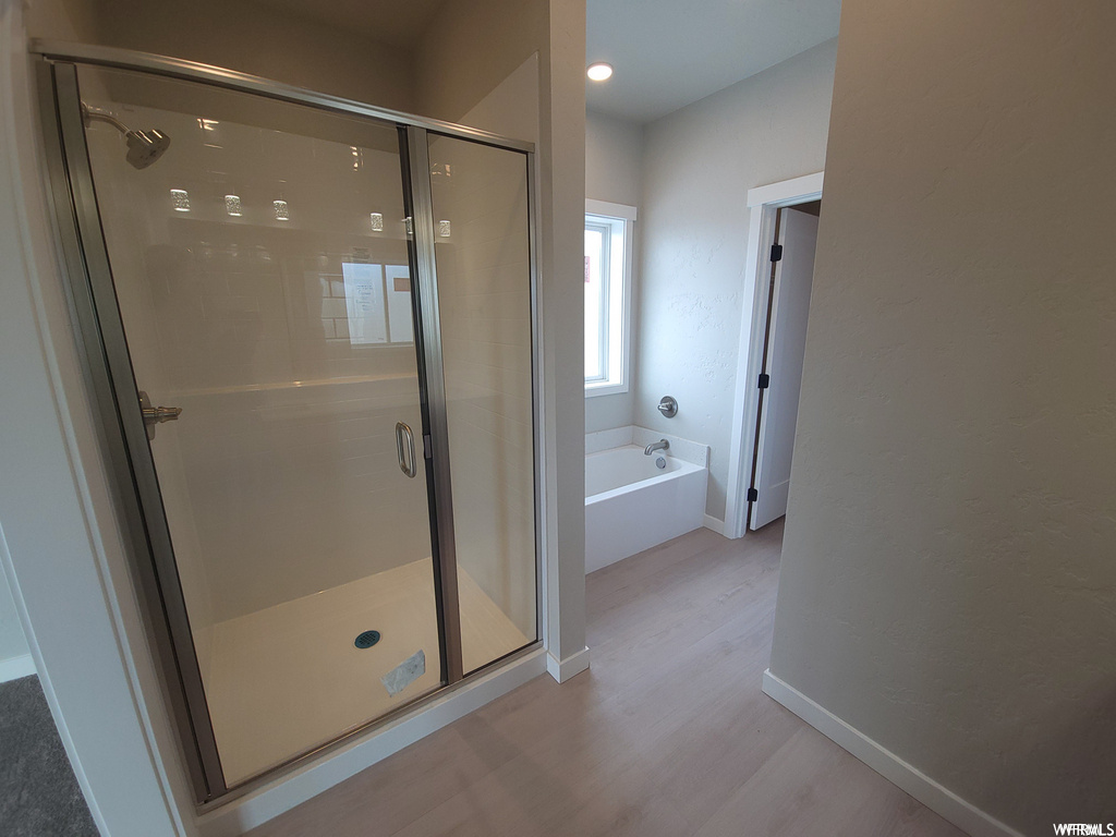 Bathroom with separate shower and tub enclosures