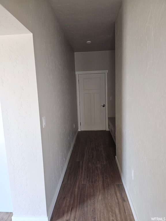 Hallway with dark parquet floors