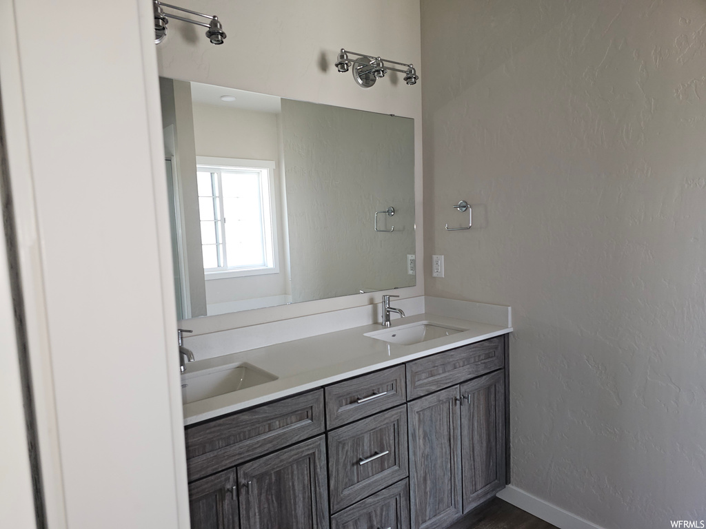 Bathroom with mirror and double sink vanity