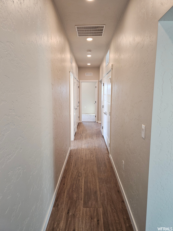 Corridor featuring light parquet floors