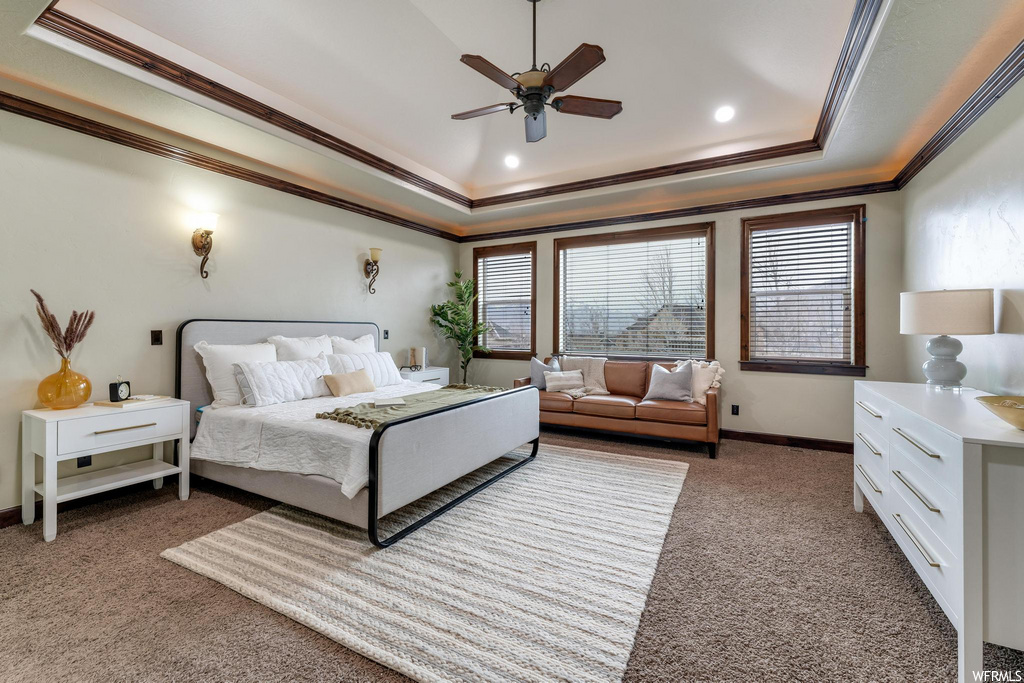 carpeted bedroom with natural light and a ceiling fan