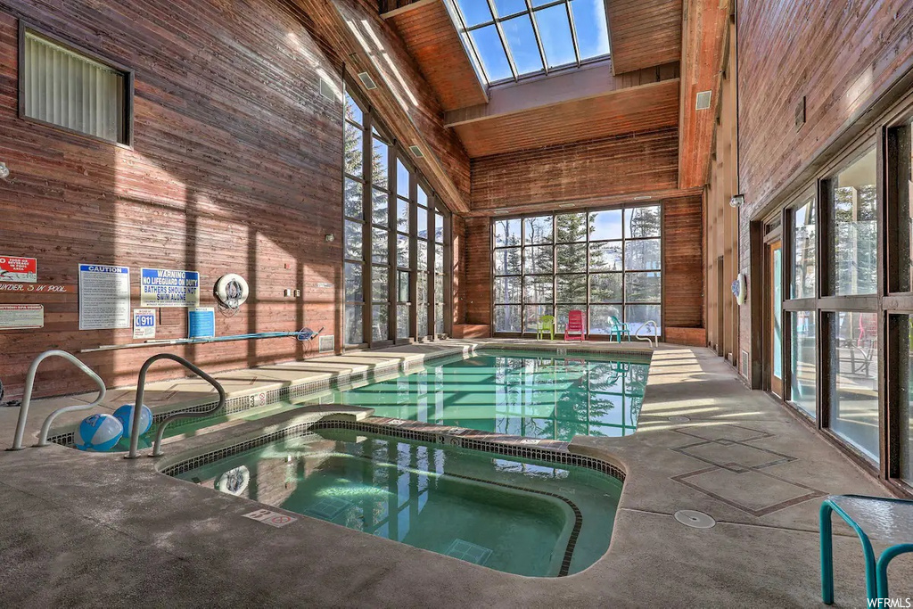 view of swimming pool with skylight