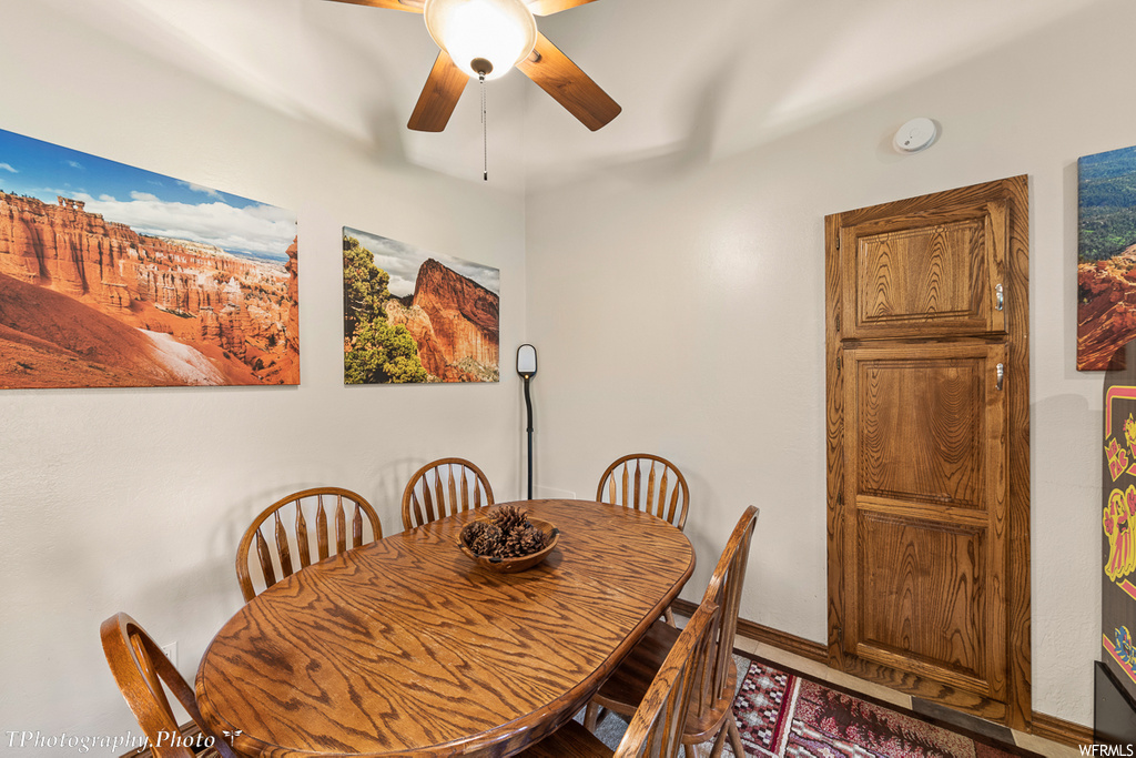 dining space with a ceiling fan