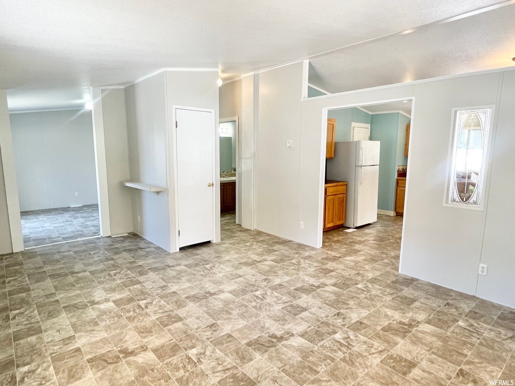 Spare room featuring tile floors