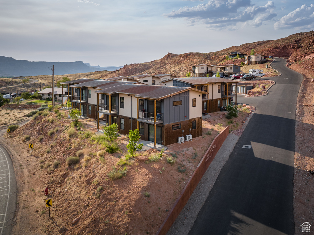 Contemporary home featuring a residential view, a balcony, and a mountain view