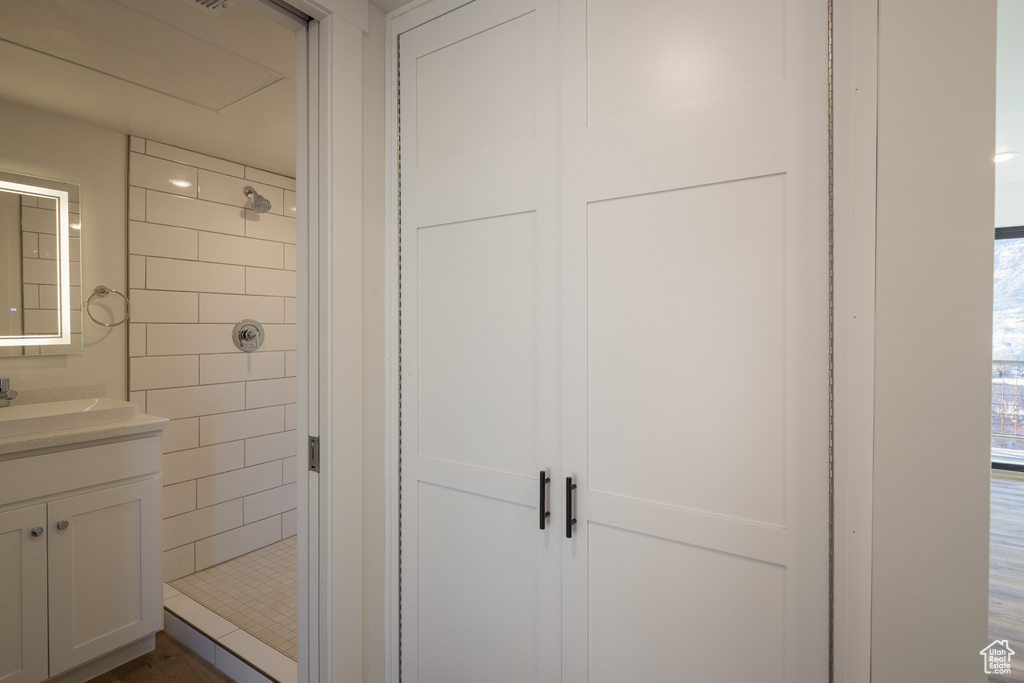Bathroom featuring a stall shower and vanity