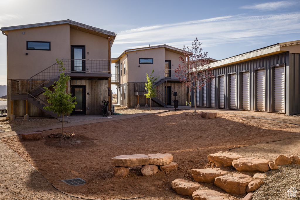 Rear view of property with stairs