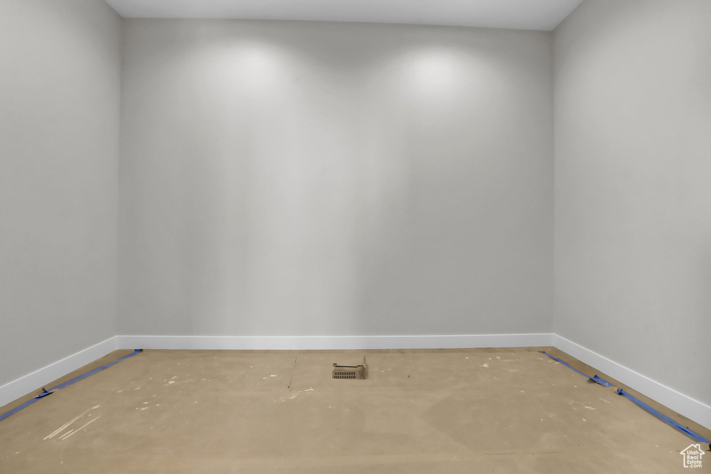 Empty room featuring concrete floors