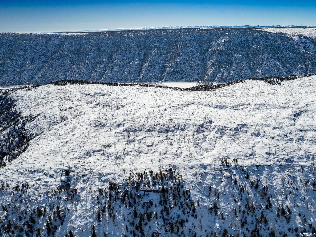 view of mountain feature featuring a water view