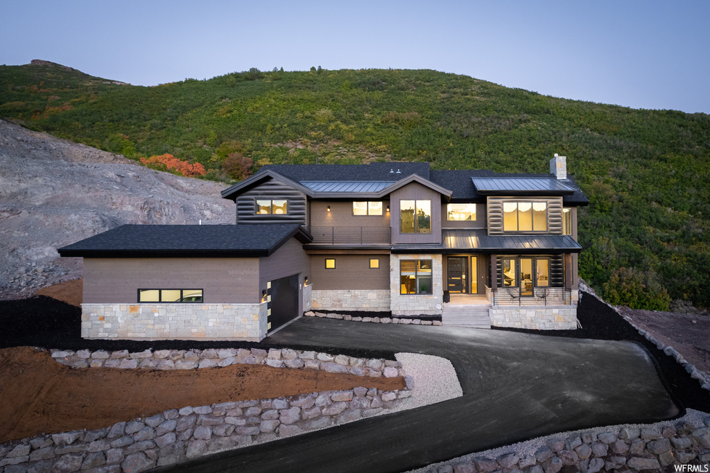 Back of property featuring a mountain view