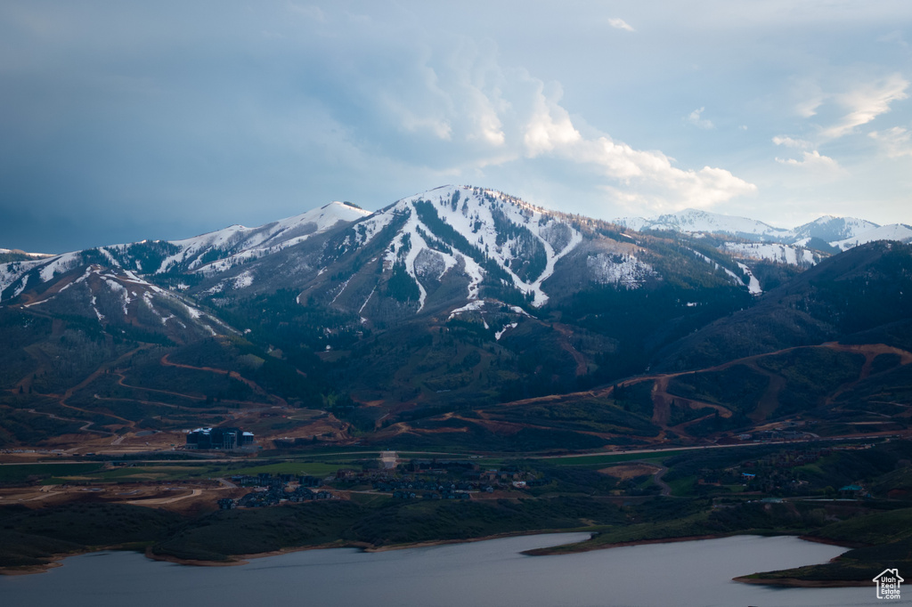 Property view of mountains featuring a water view