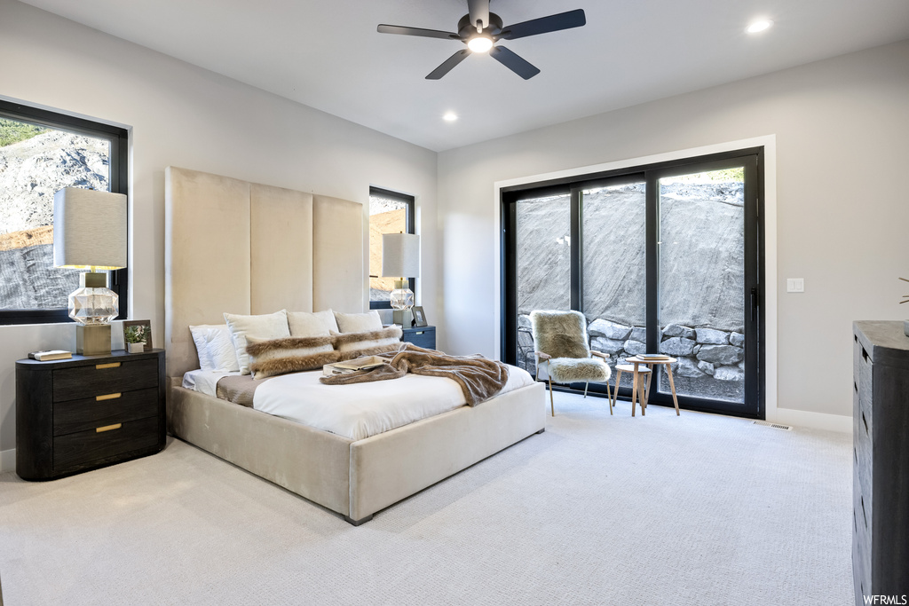 Bedroom with light carpet and ceiling fan