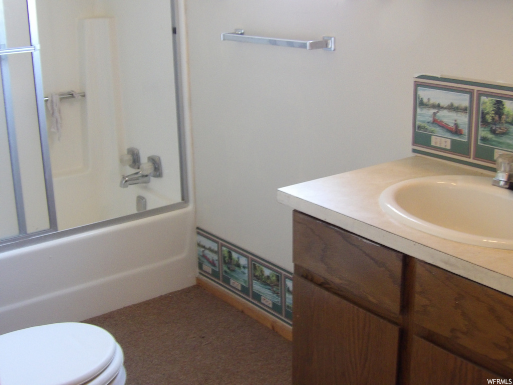 Full bathroom with toilet, shower / washtub combination, and vanity
