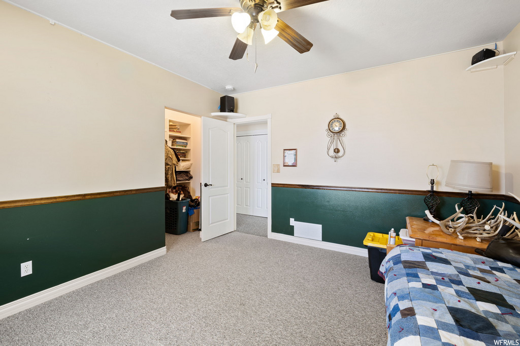 bedroom featuring carpet and a ceiling fan