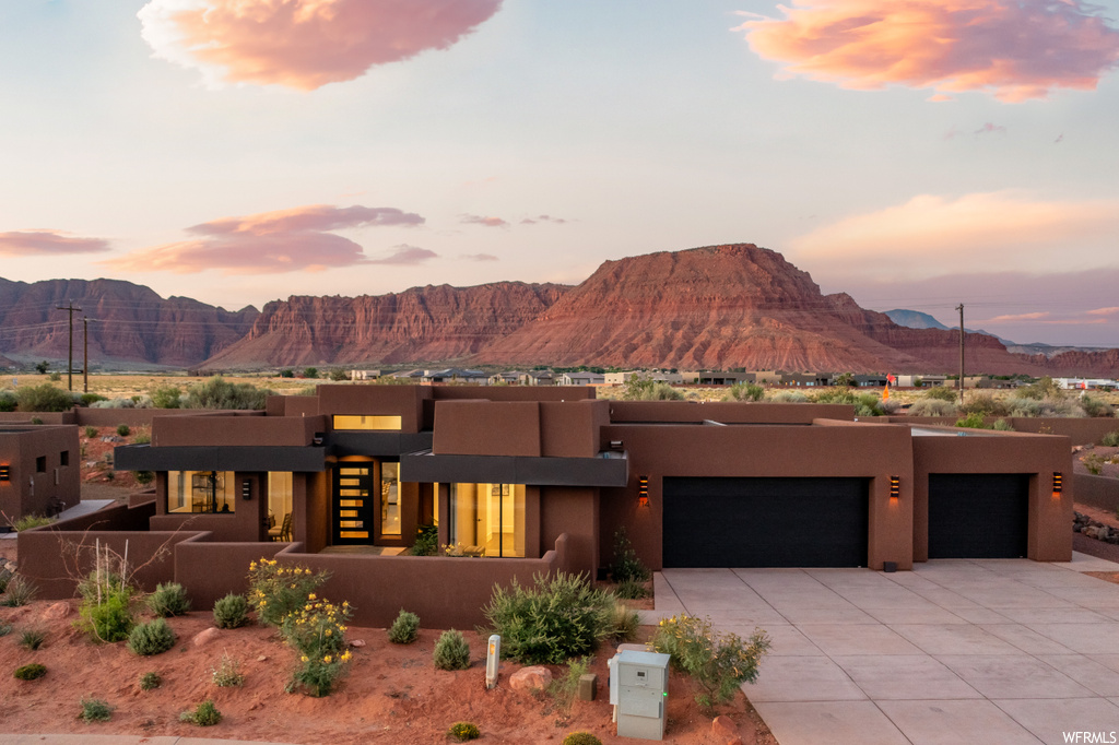 Pueblo-style home with a mountain view