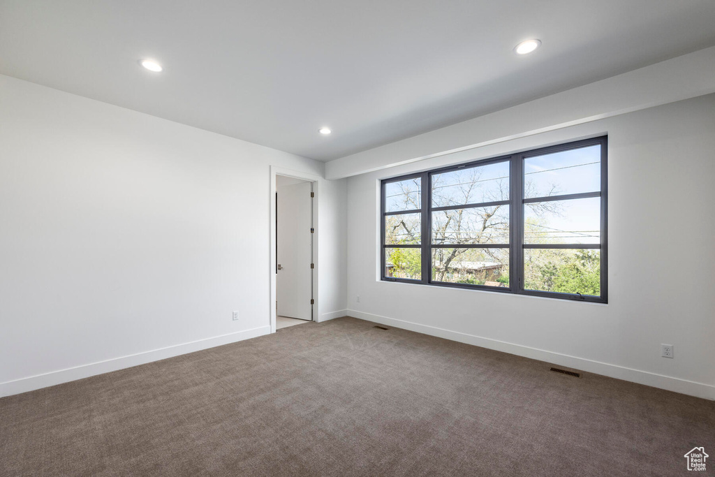 Unfurnished room with carpet flooring