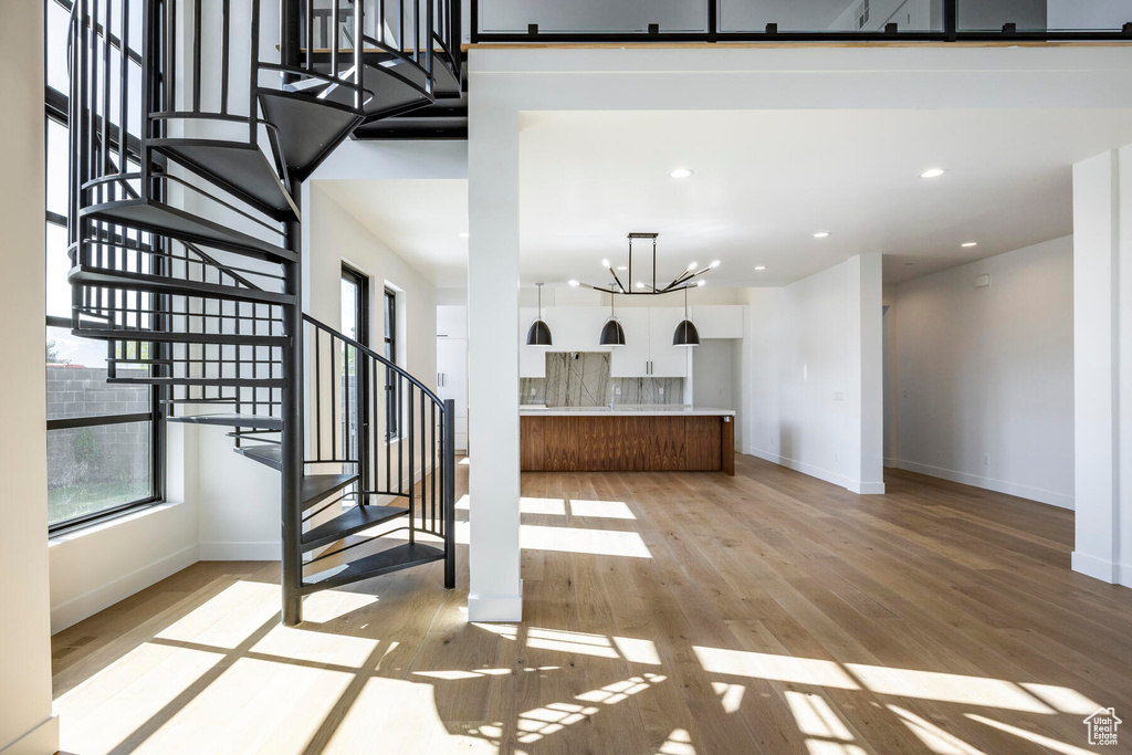 Interior space featuring a chandelier and light hardwood / wood-style flooring