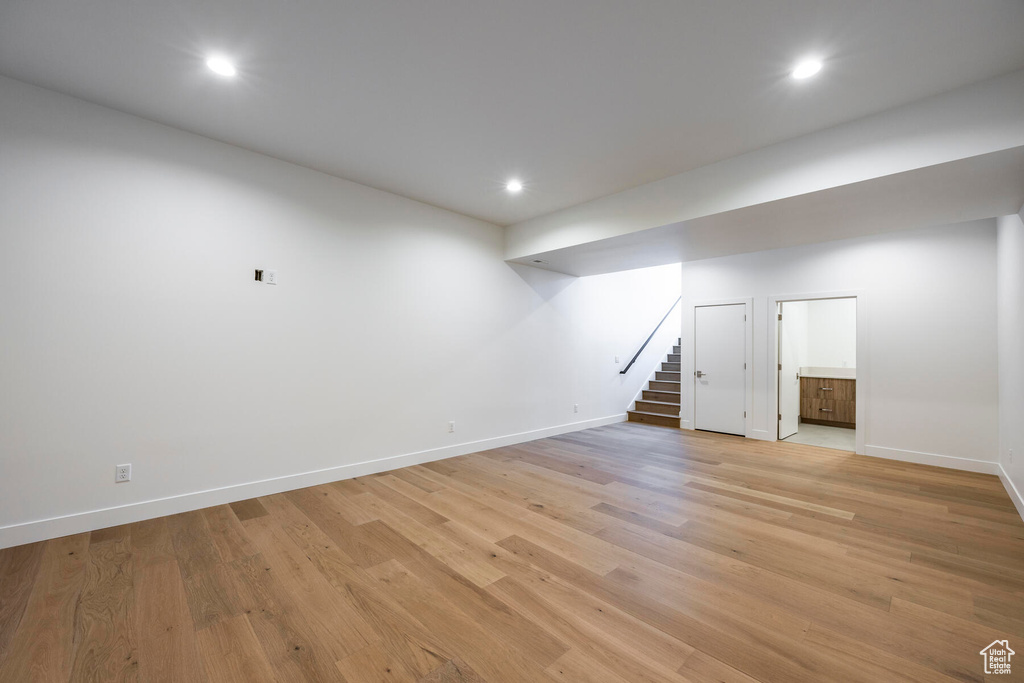 Basement featuring light hardwood / wood-style floors