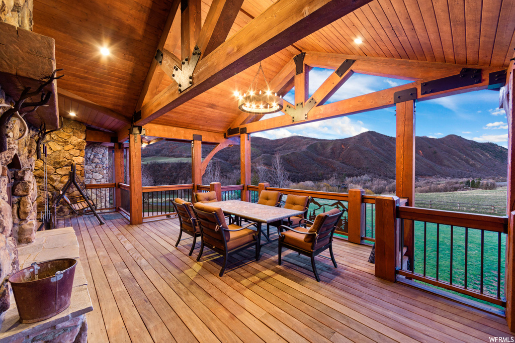 wooden terrace with a mountain view