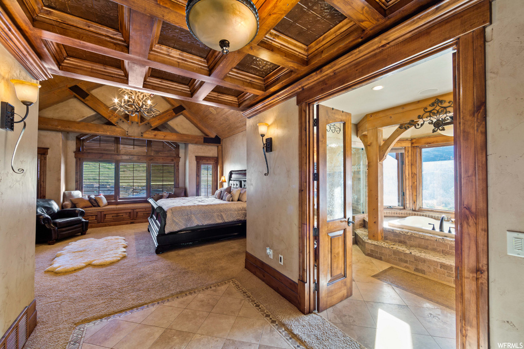tiled bedroom with coffered ceiling, wood beam ceiling, and multiple windows