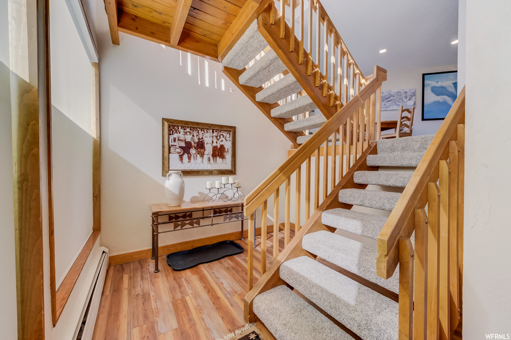 staircase featuring hardwood flooring
