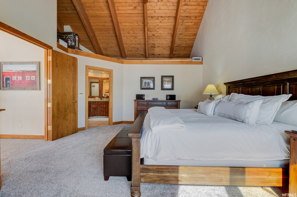 bedroom featuring lofted ceiling with beams