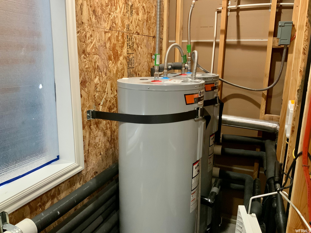 utility room with water heater