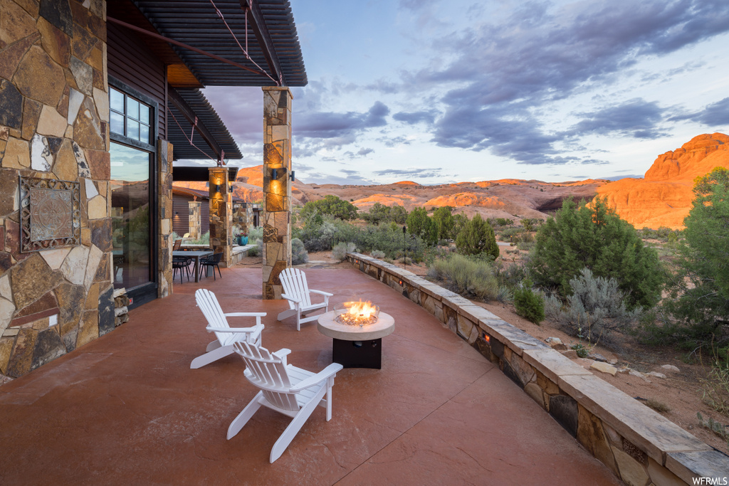 view of patio / terrace featuring fire pit