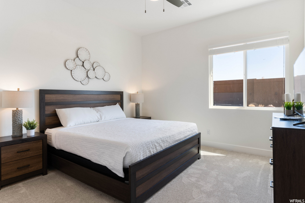 carpeted bedroom featuring natural light