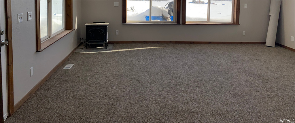 empty room with carpet and natural light