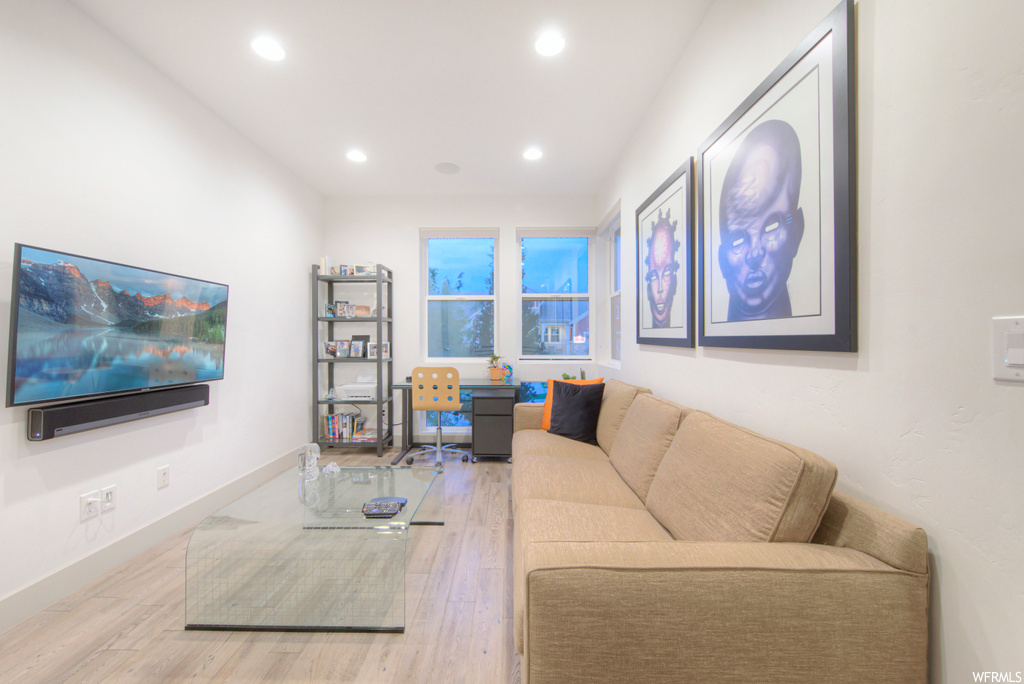 Living room featuring light hardwood flooring