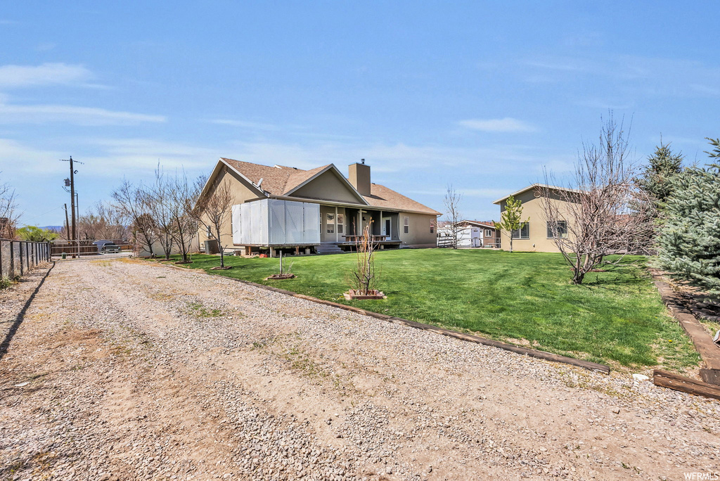 Single story home featuring a front yard