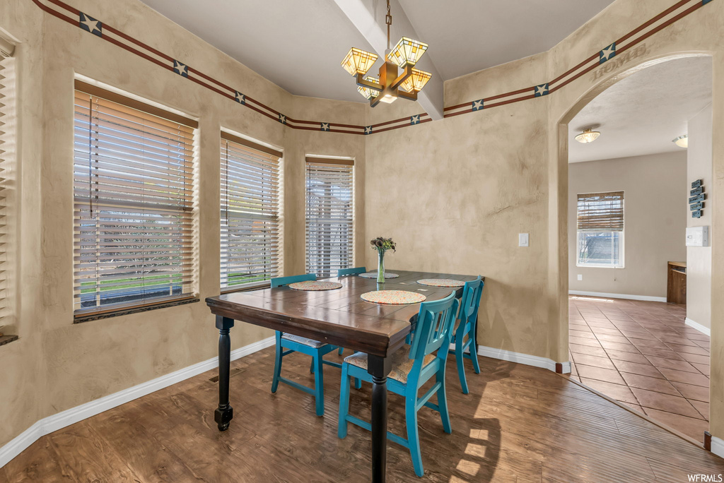 Dining space featuring tile floors and natural light