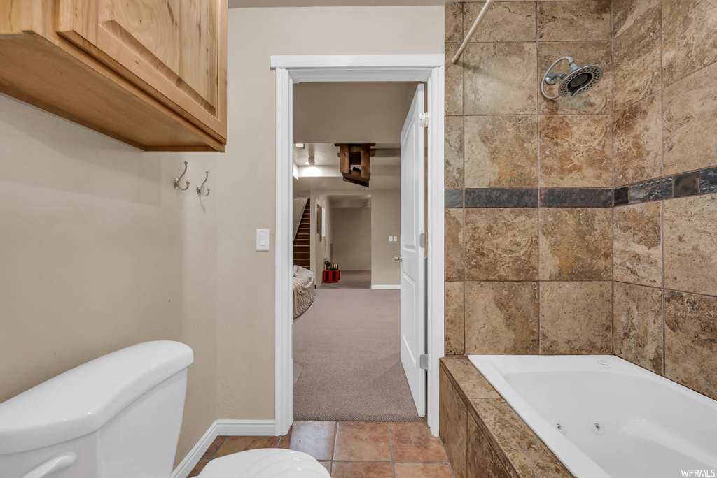 Bathroom with tile flooring and toilet