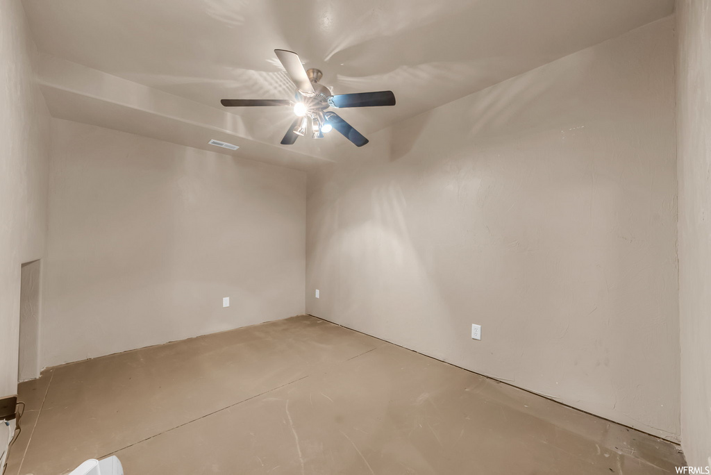 Spare room featuring a ceiling fan