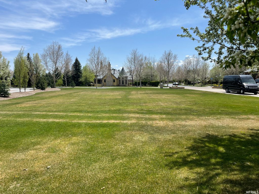 view of property\'s community featuring a yard
