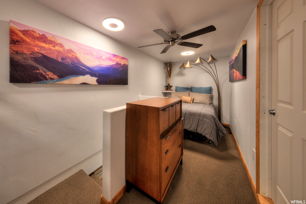 carpeted bedroom with a ceiling fan