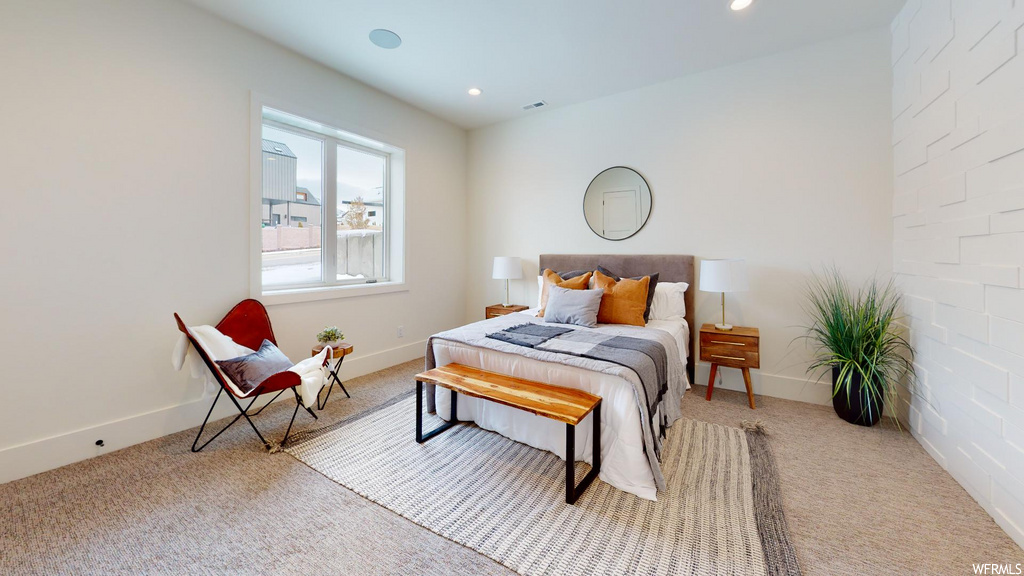 bedroom with natural light and carpet