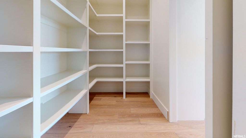 pantry with hardwood floors