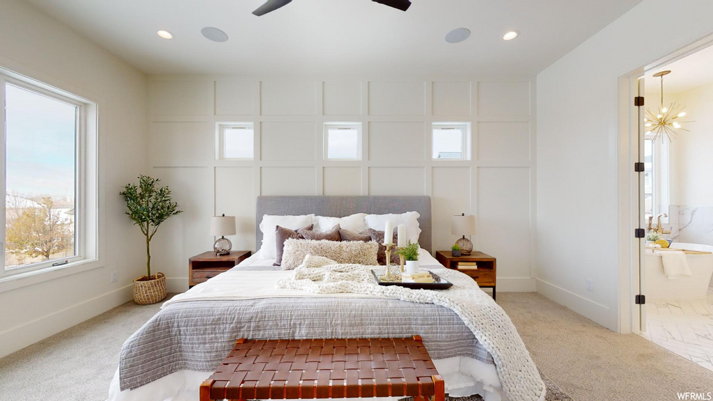 bedroom featuring multiple windows, carpet, and a ceiling fan