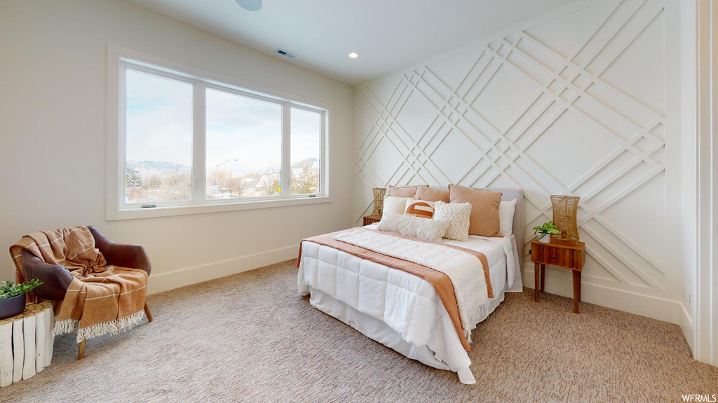 bedroom with natural light and carpet