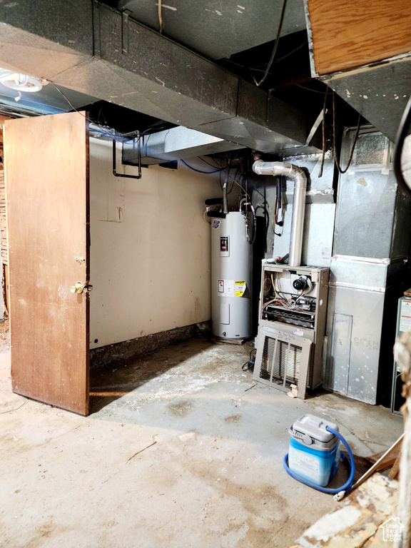 Basement featuring electric water heater