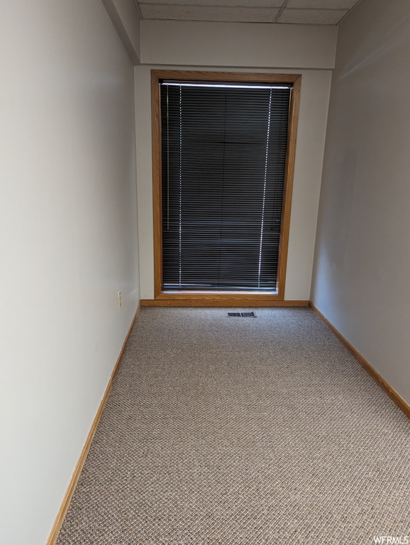 Spare room featuring carpet