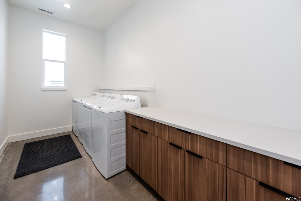 washroom featuring natural light and washer / dryer