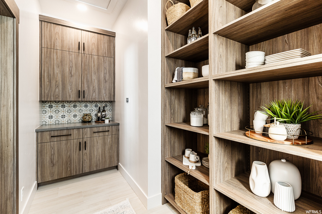 pantry with hardwood flooring