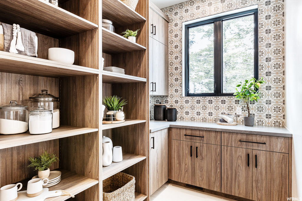 pantry featuring hardwood floors