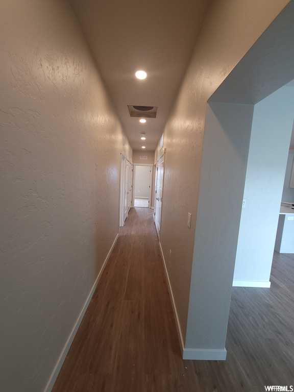 Corridor featuring hardwood floors