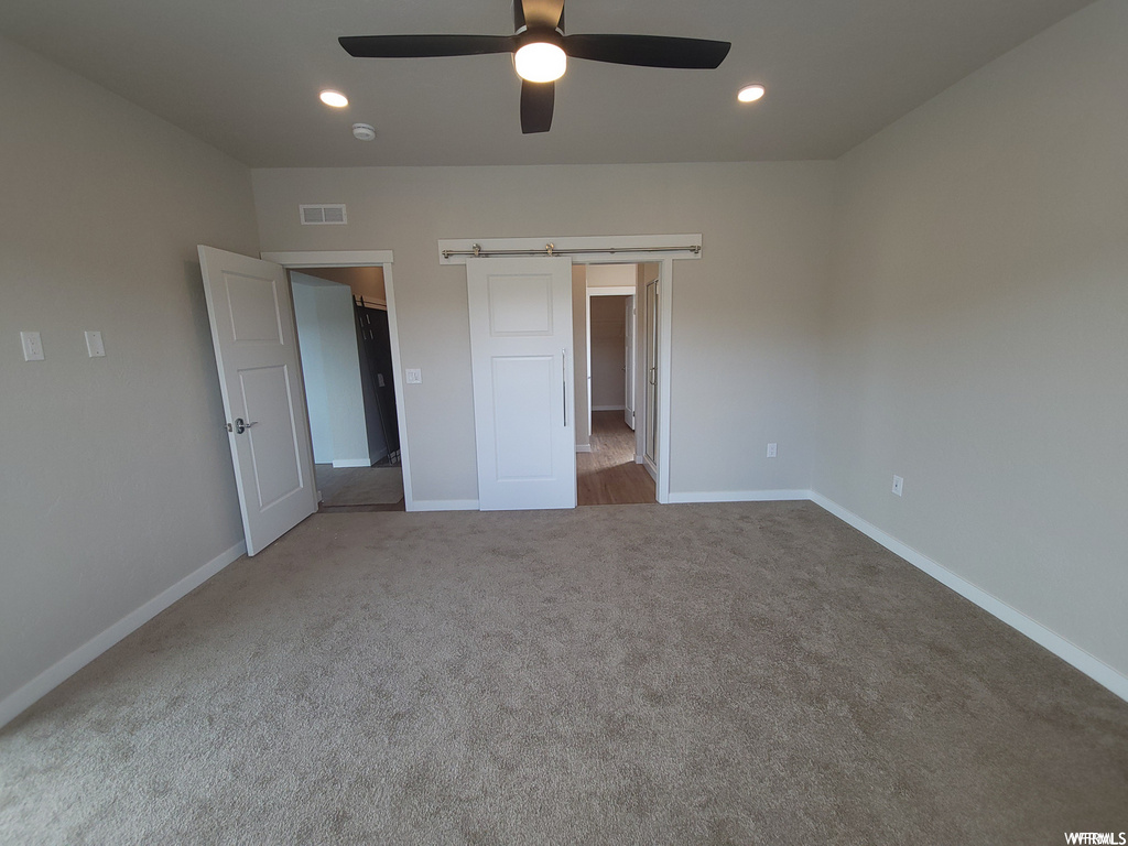Bedroom with carpet and a ceiling fan